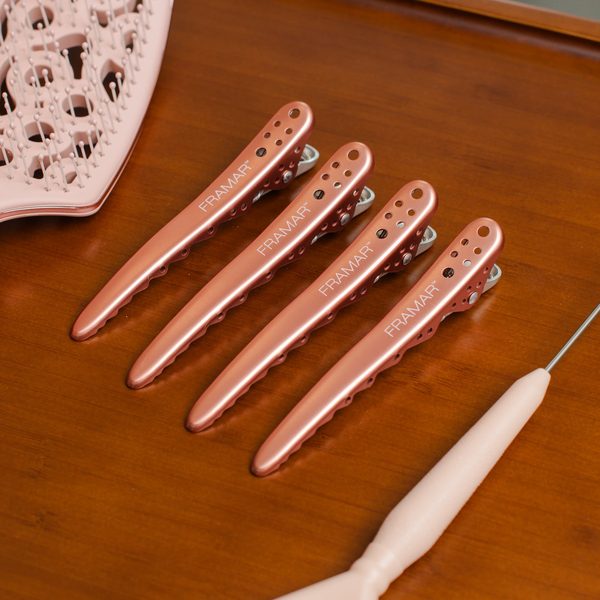 Čtyři pinety Big Bite Rose Gold na stolku